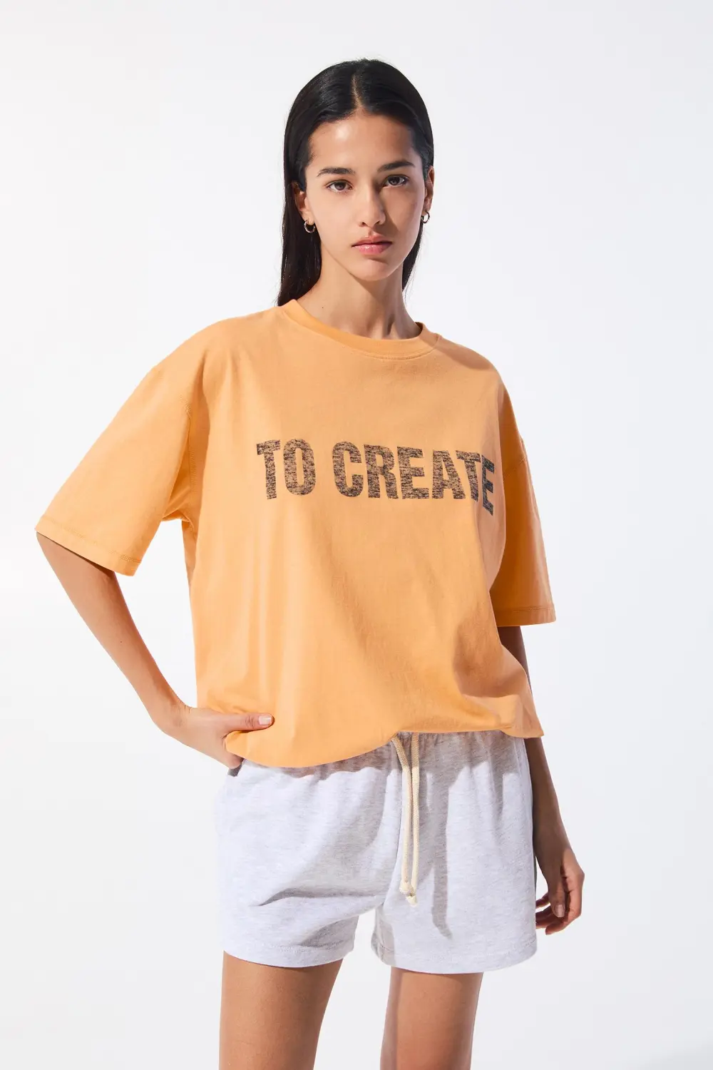 Camiseta naranja texto