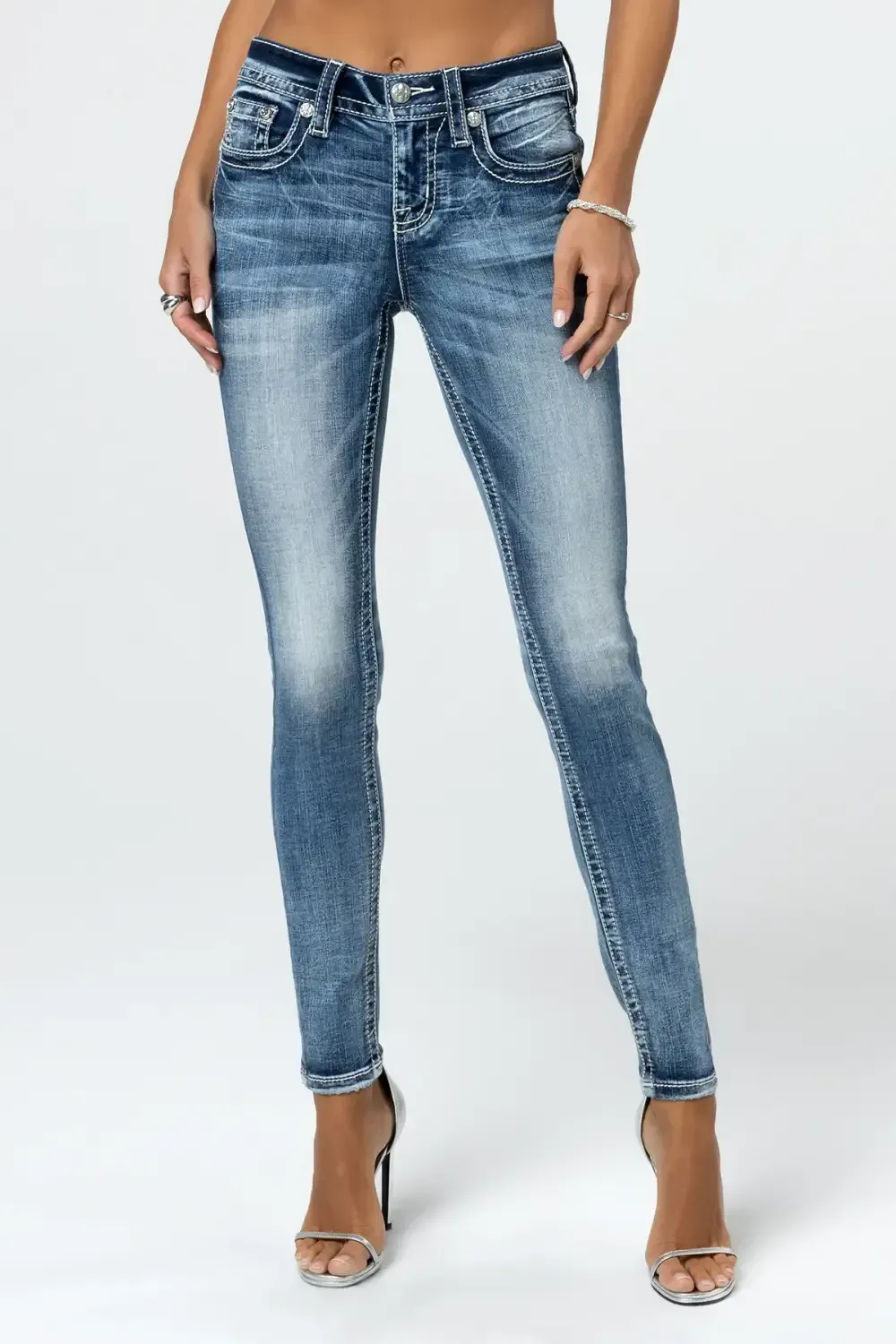 Torn Saddle Stitch Skinny Jeans