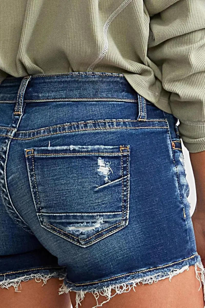 Ripped Raw Hem Button Up Mid Rise Denim Shorts
