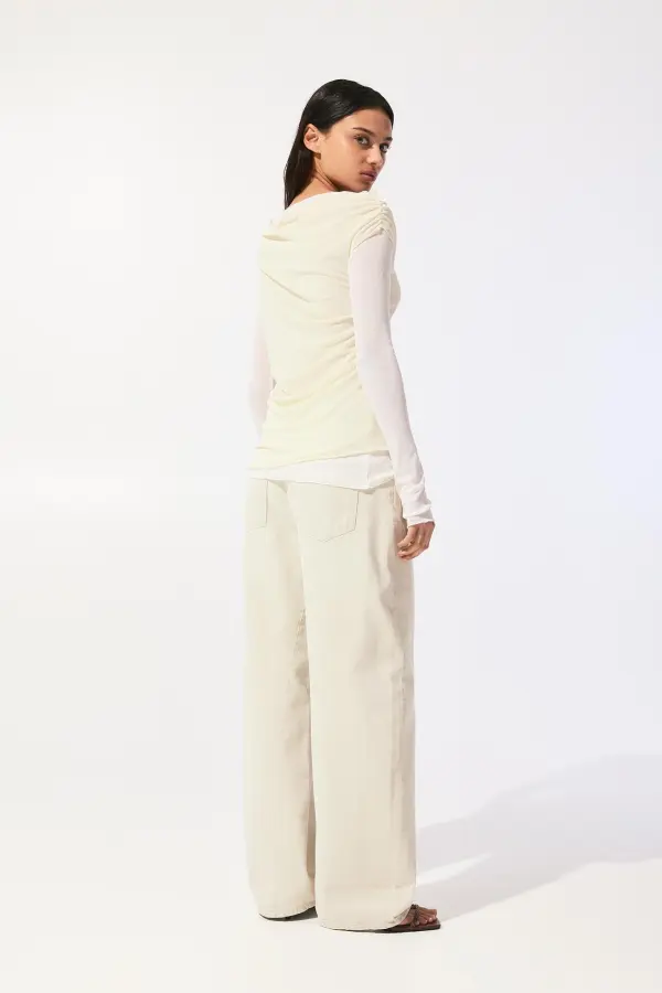 Semi-sheer asymmetric double-layer top