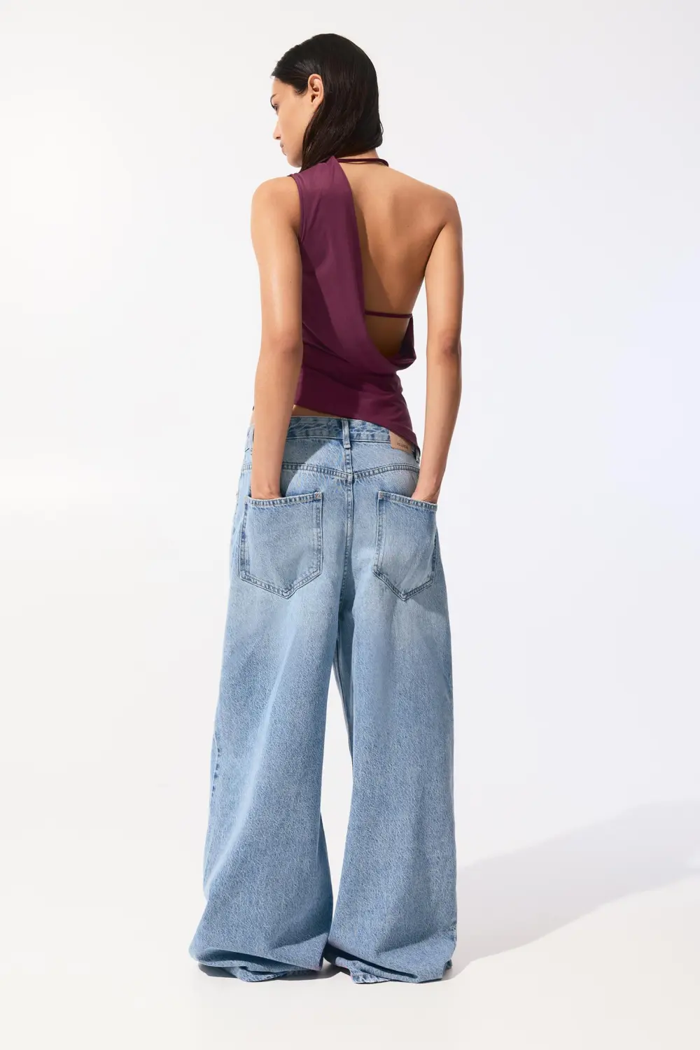 Asymmetric top with strap
