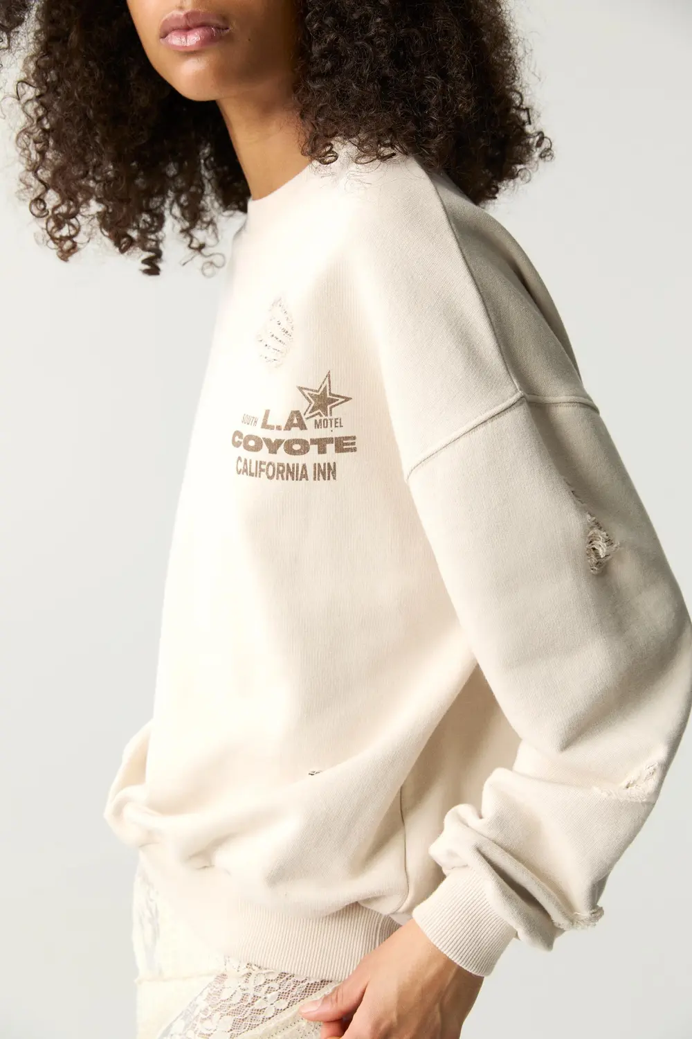 Sudadera motel detalle rotos