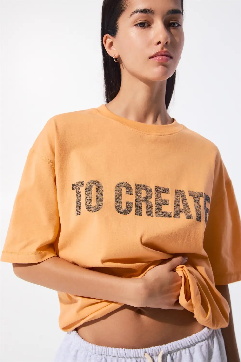 Camiseta naranja texto