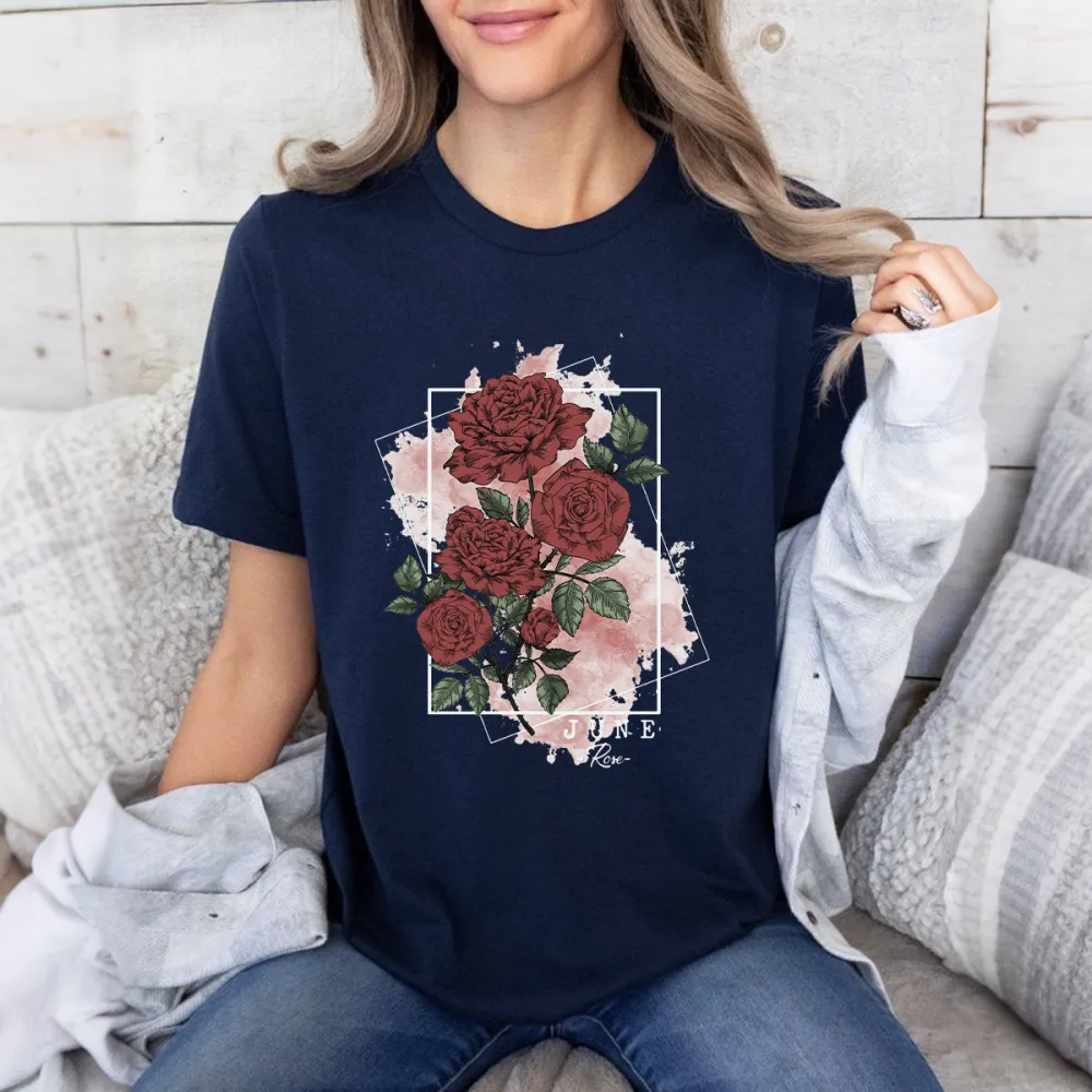 “June”, “Flor”, A Floral Pattern With Deep Red Roses And Green Leaves On A Light Pink Watercolor Background Framed By A Black Square, Casual T-Shirt