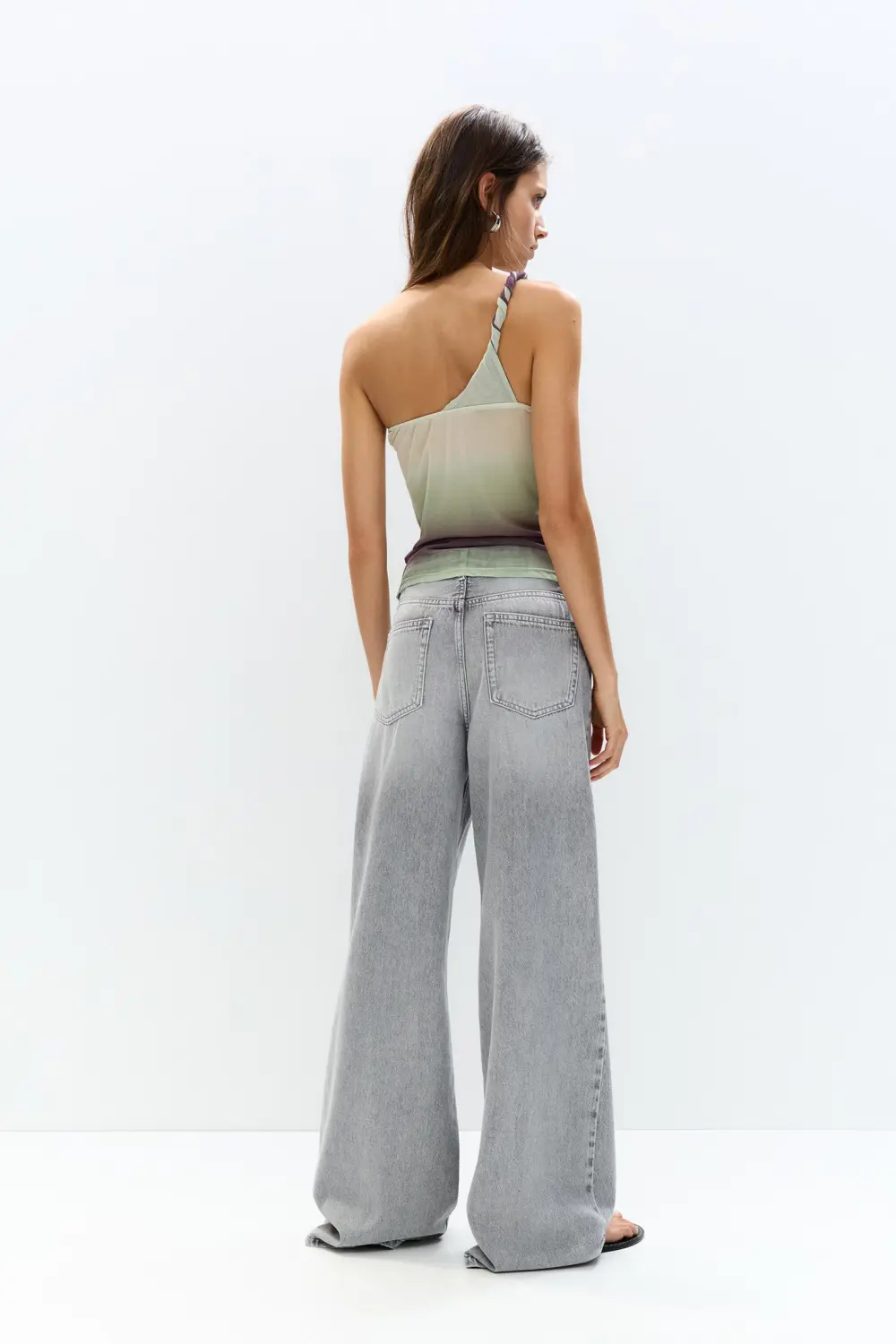 Asymmetric tulle top with a knotted strap