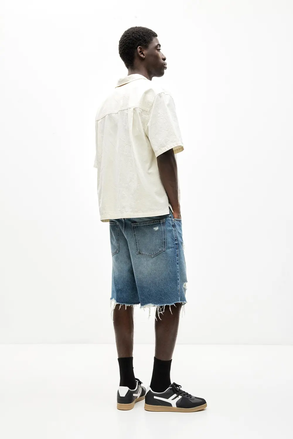 Ripped denim Bermuda shorts