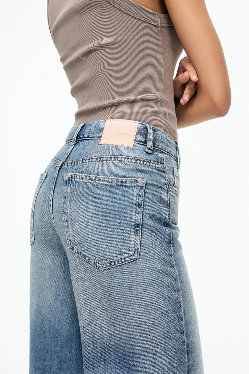 Jeans wide leg cintura cruzada